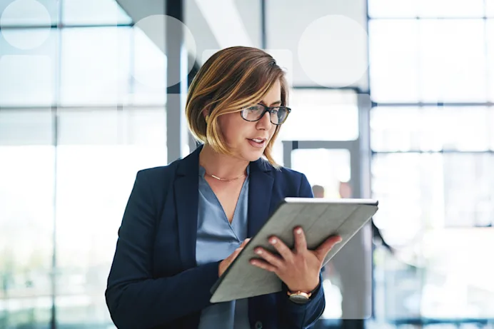 Woman looking at her tablet screen
