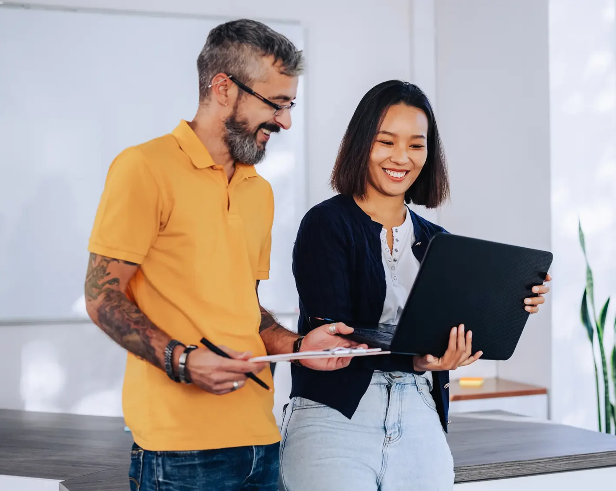 happy employees looking at computer