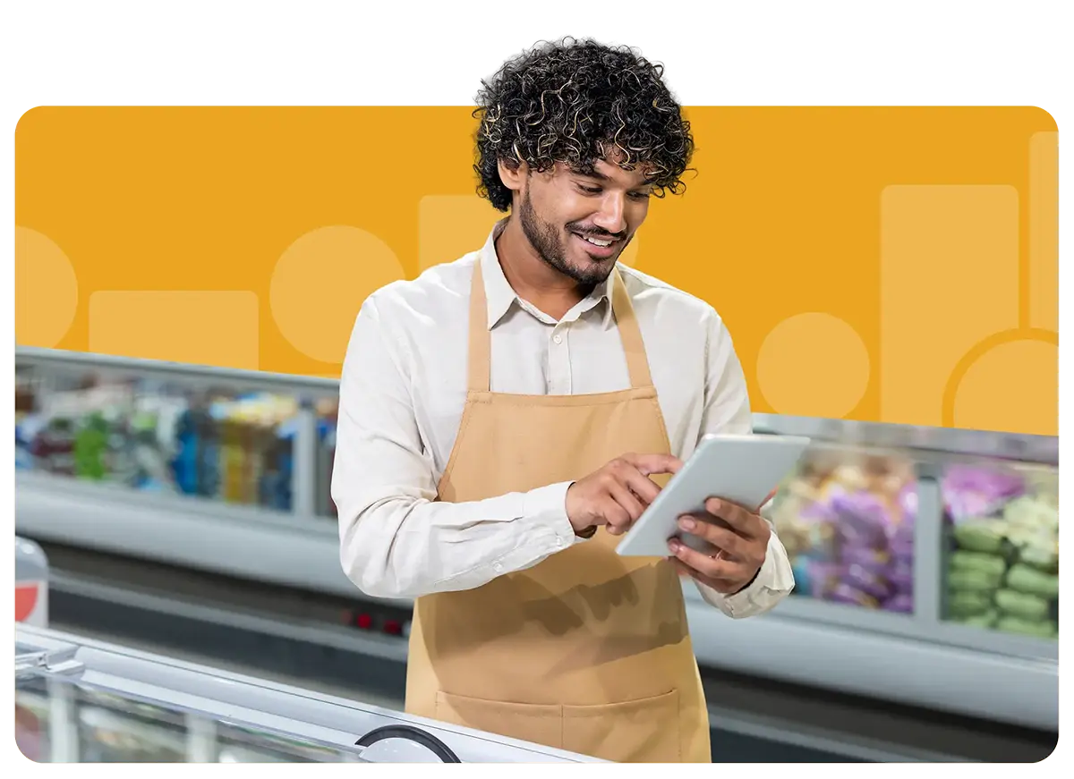 Grocery worker looking over list on tablet