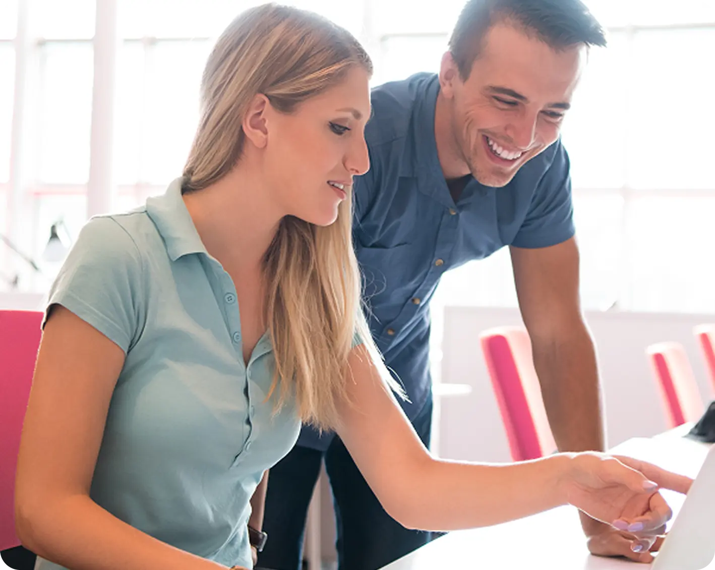 coworkers looking at cobra info on computer