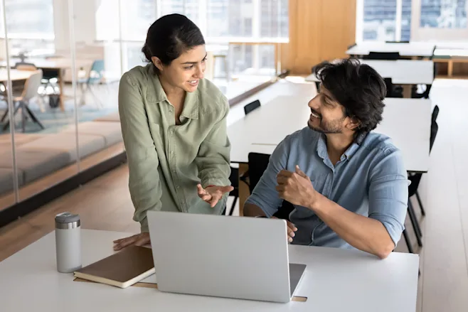 Man and Woman working together at a laptop