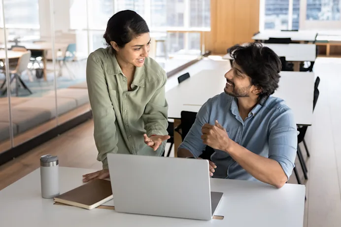 Man and Woman working together at a laptop