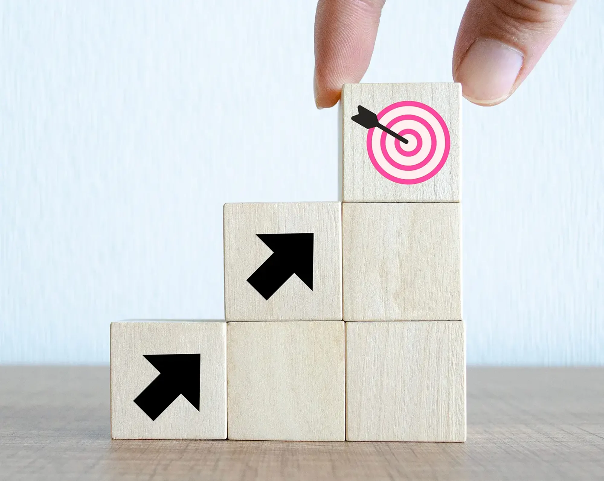 woman stacking blocks with target