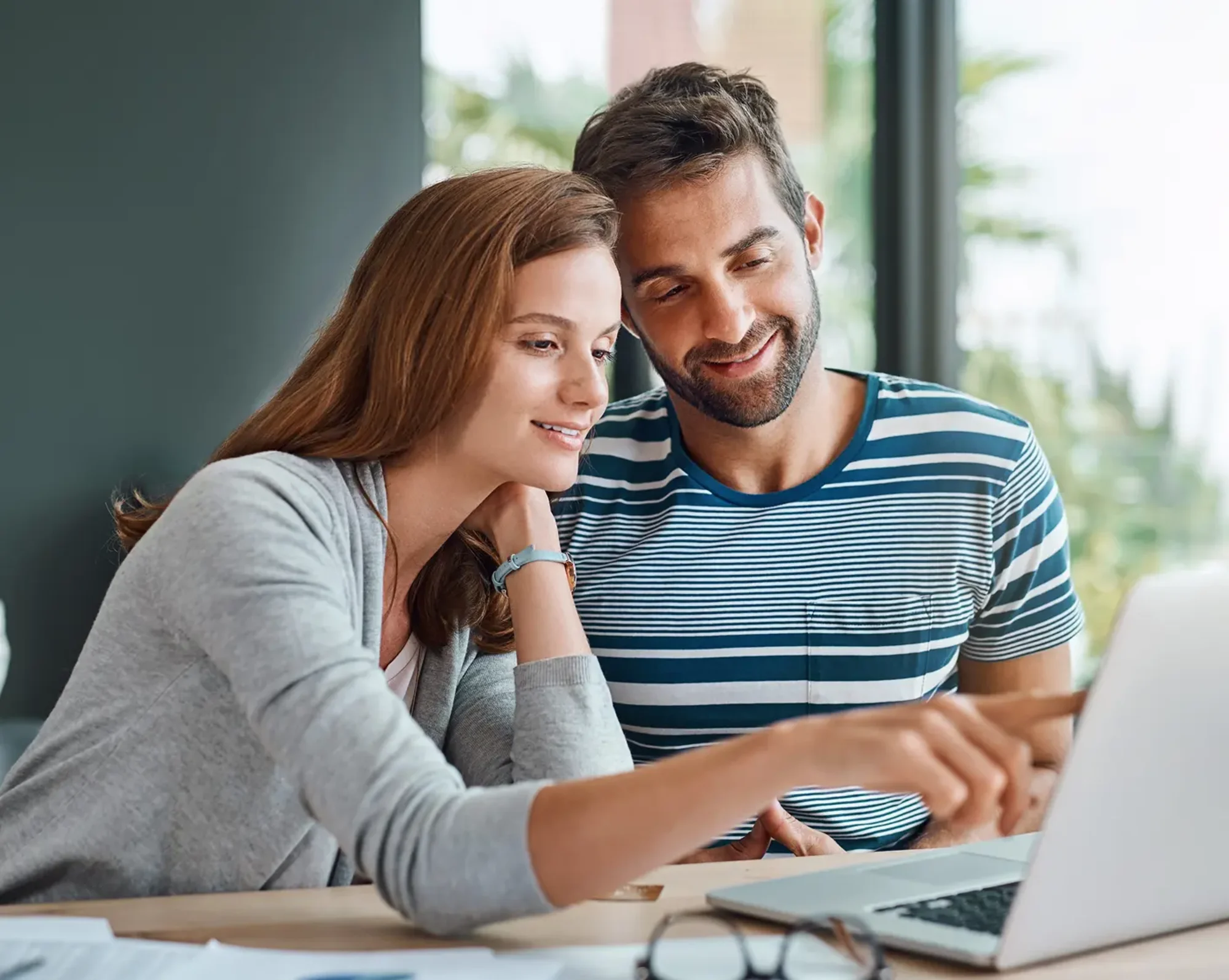 couple looking over benefits offered at company