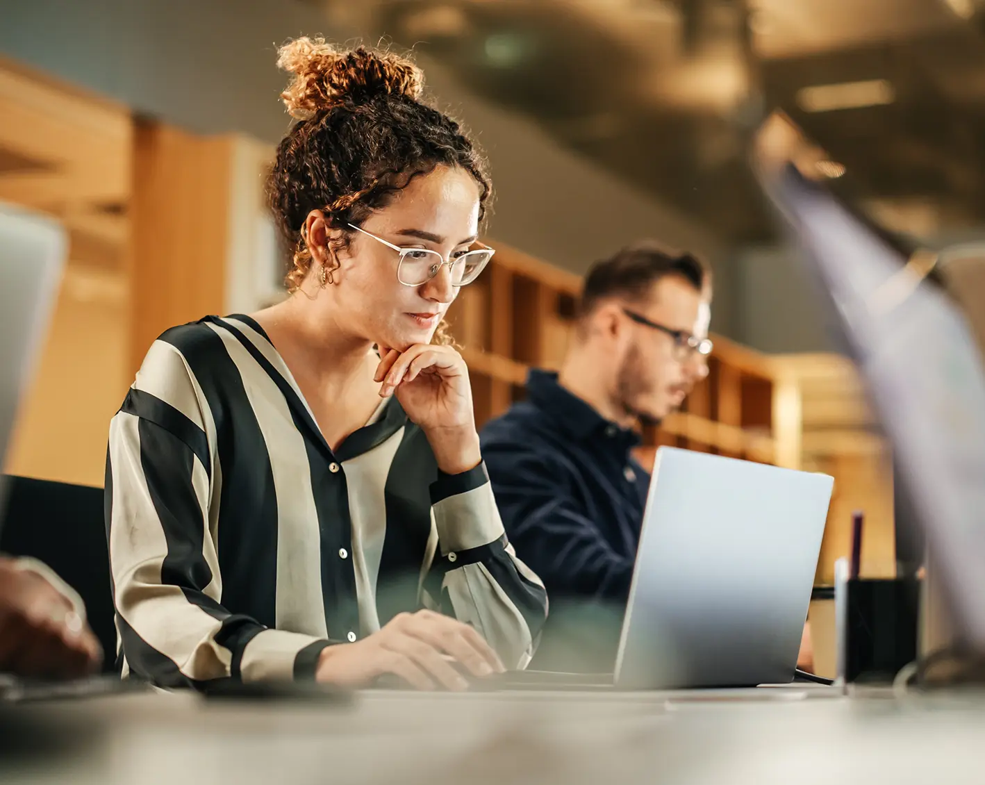 woman on computer looking at company rewards