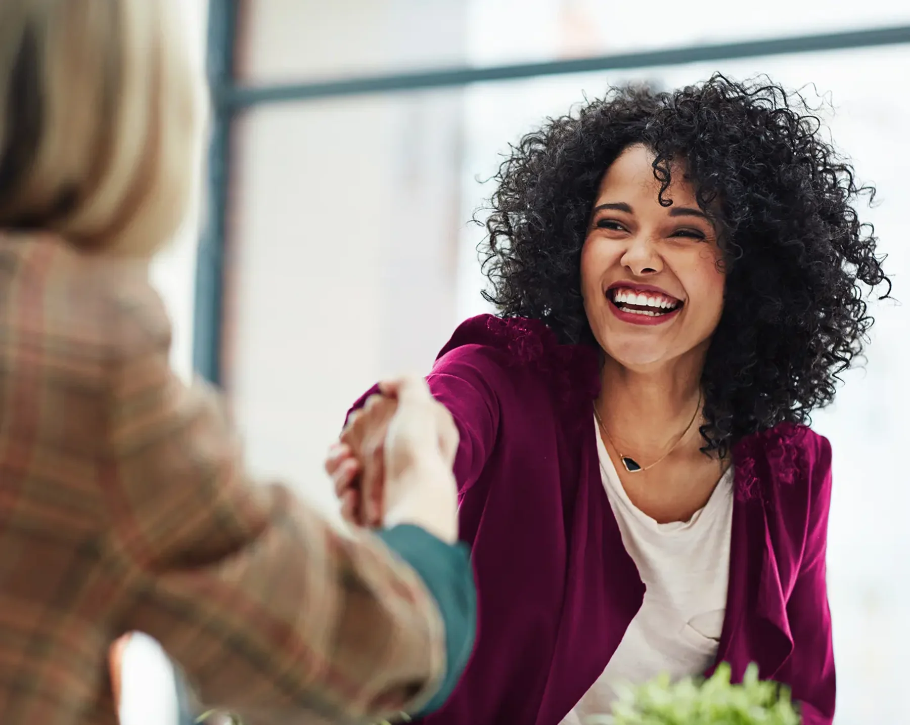 business woman shaking hands with client