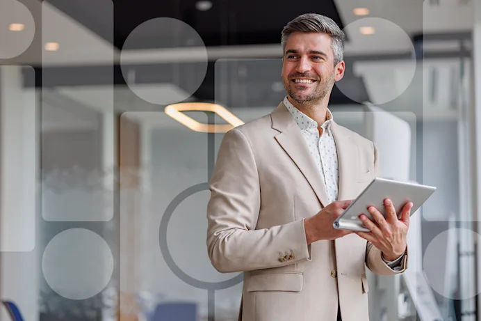 Smiling man holding a tablet