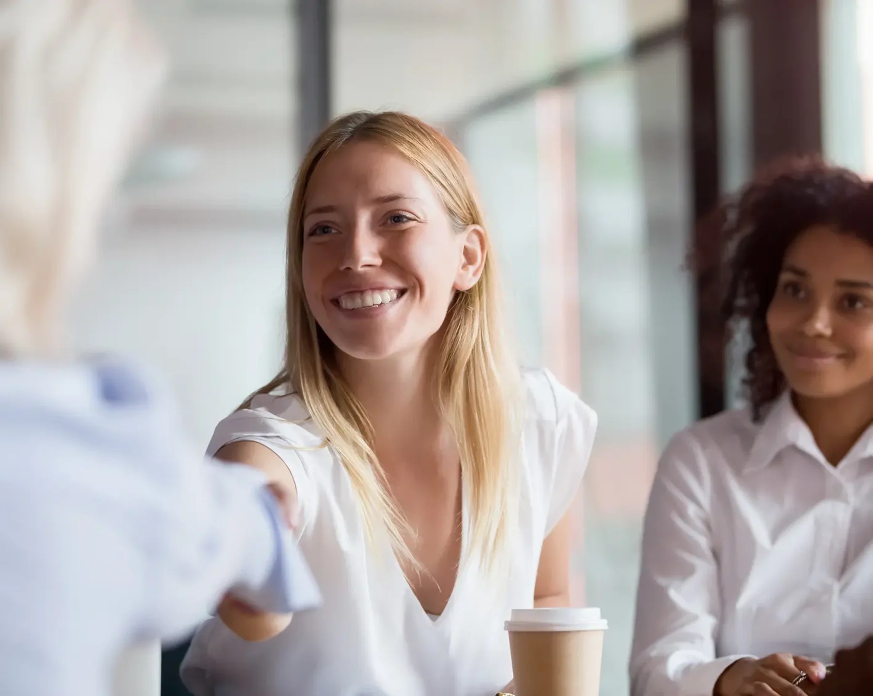 woman shaking hands with new employee