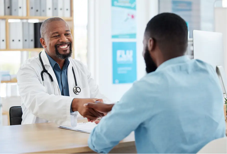 employee at the desk with doctor
