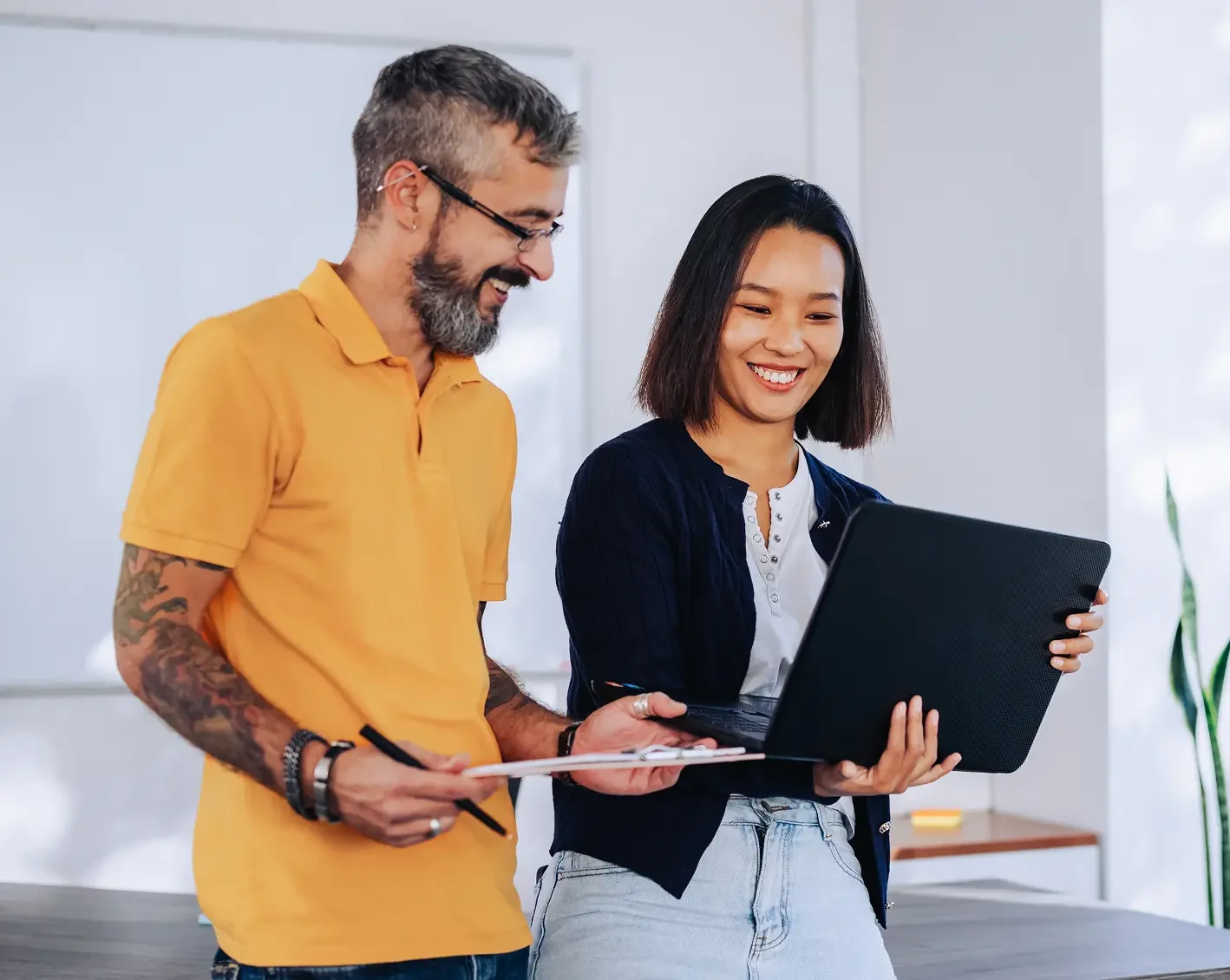 accounting firm executives looking at laptop