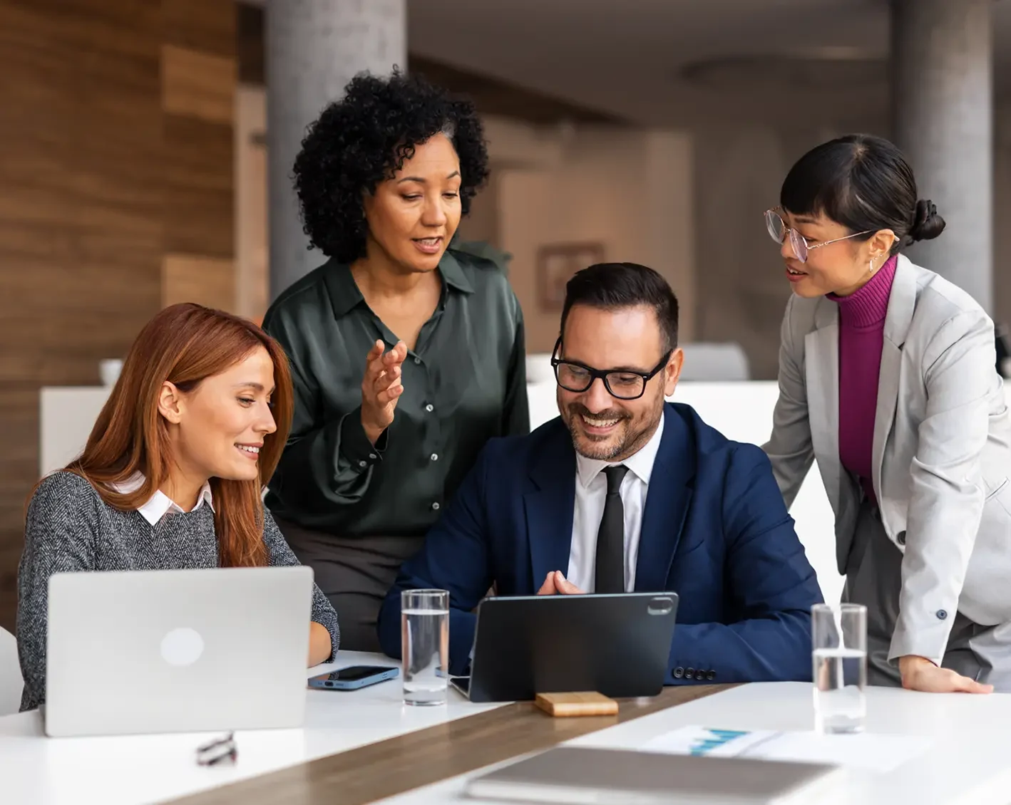 accounting firm executives looking at laptop