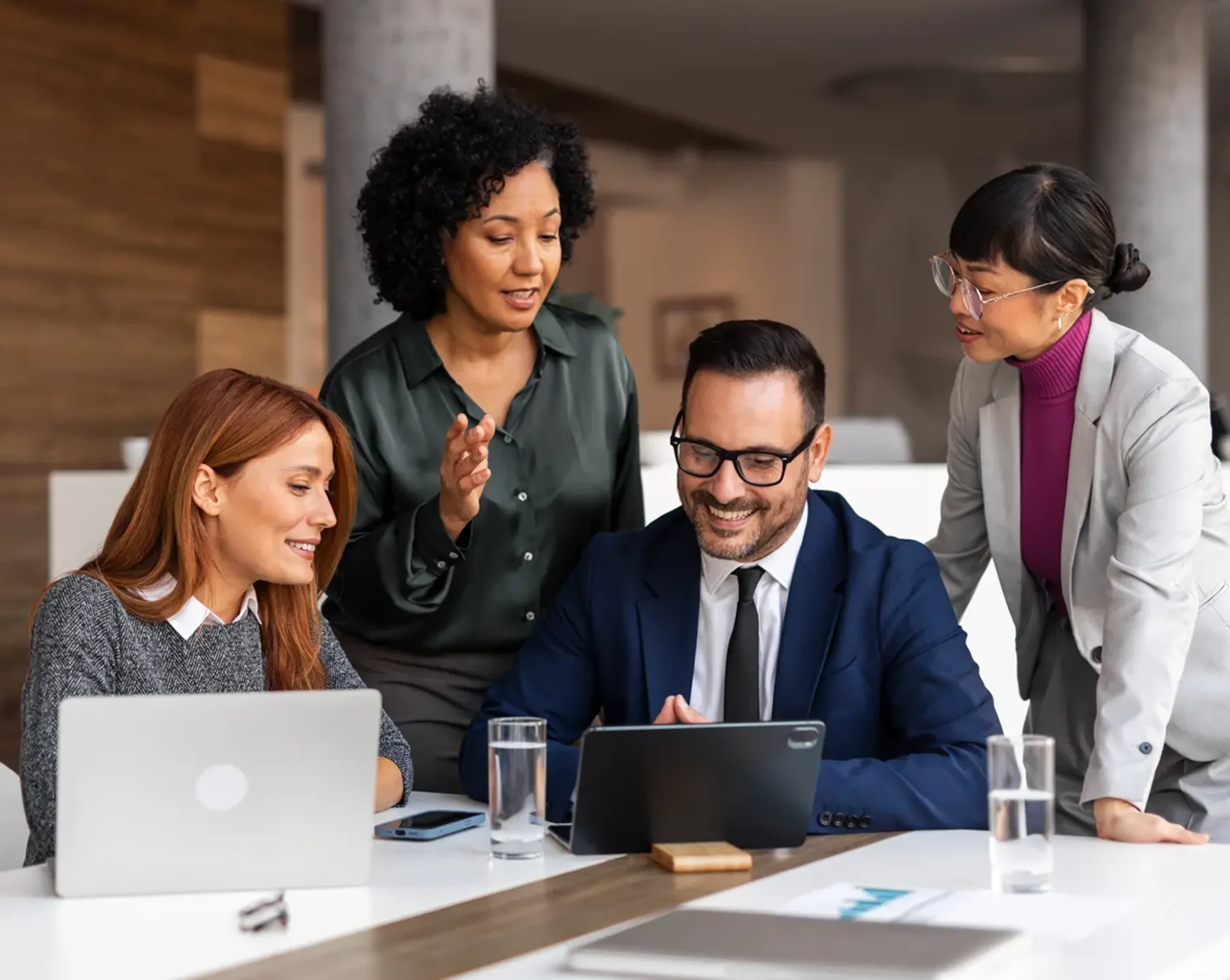 accounting firm executives looking at laptop