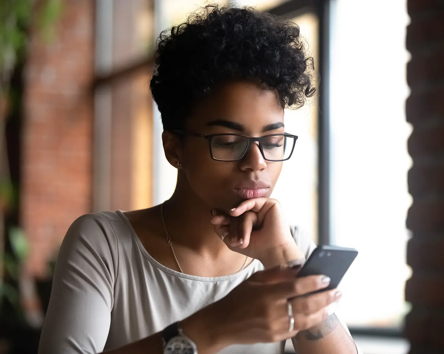 woman looking at healthcare benefits on phone