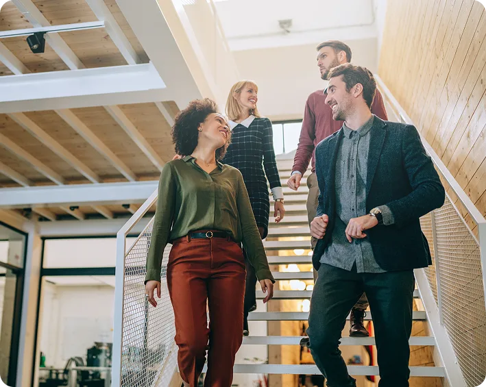 group of entrepreneurs walking down stairs
