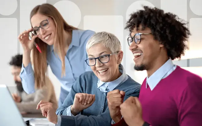 employees at computer cheering