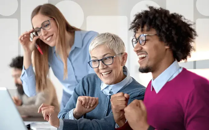 employees at computer cheering