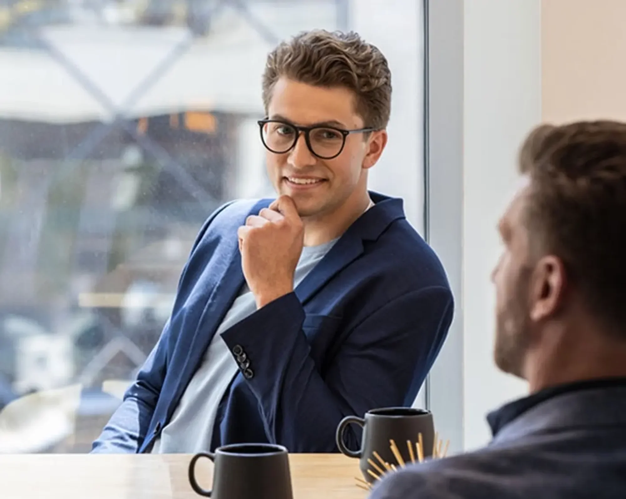 company owner smiling at meeting