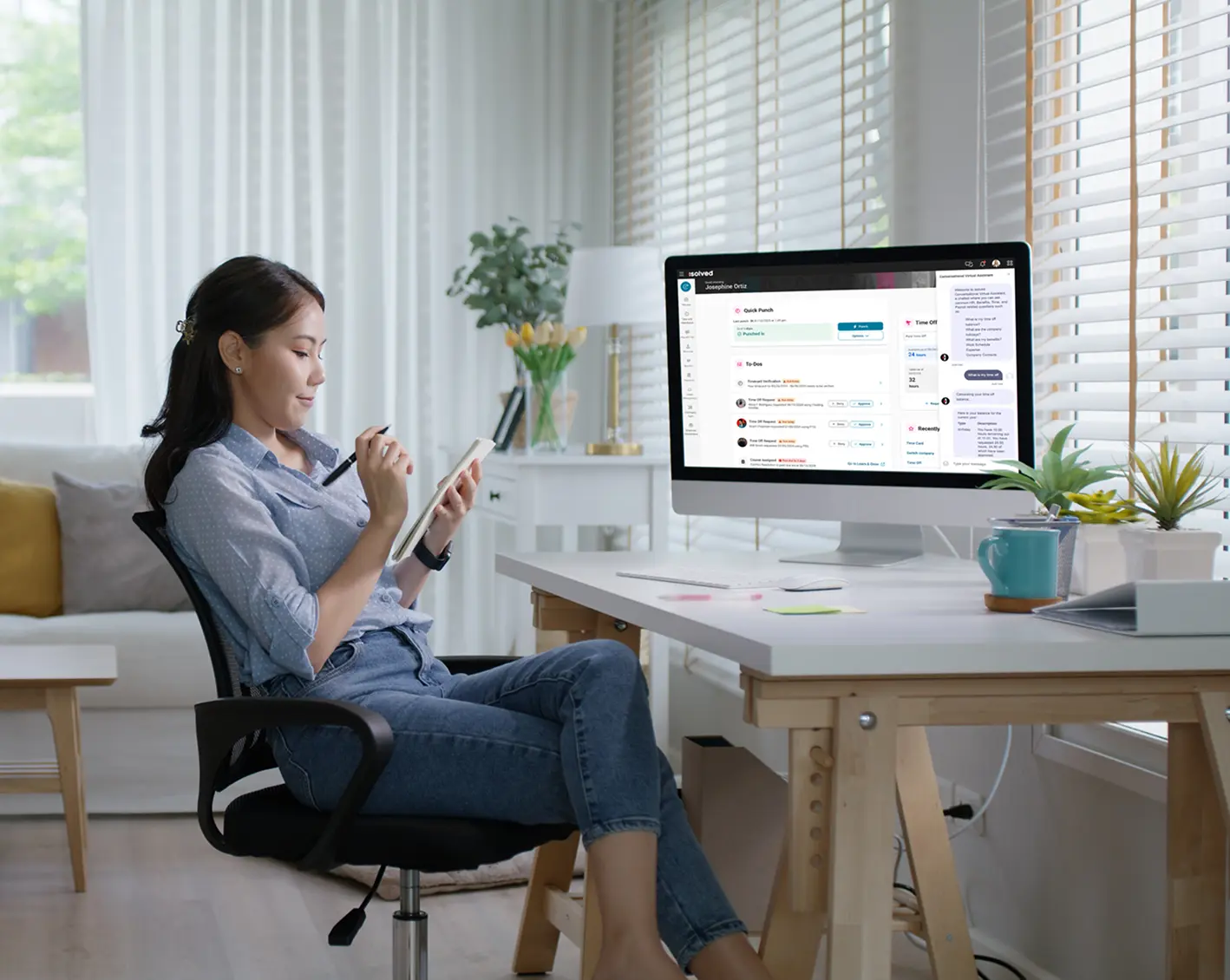 woman in home office using payroll system