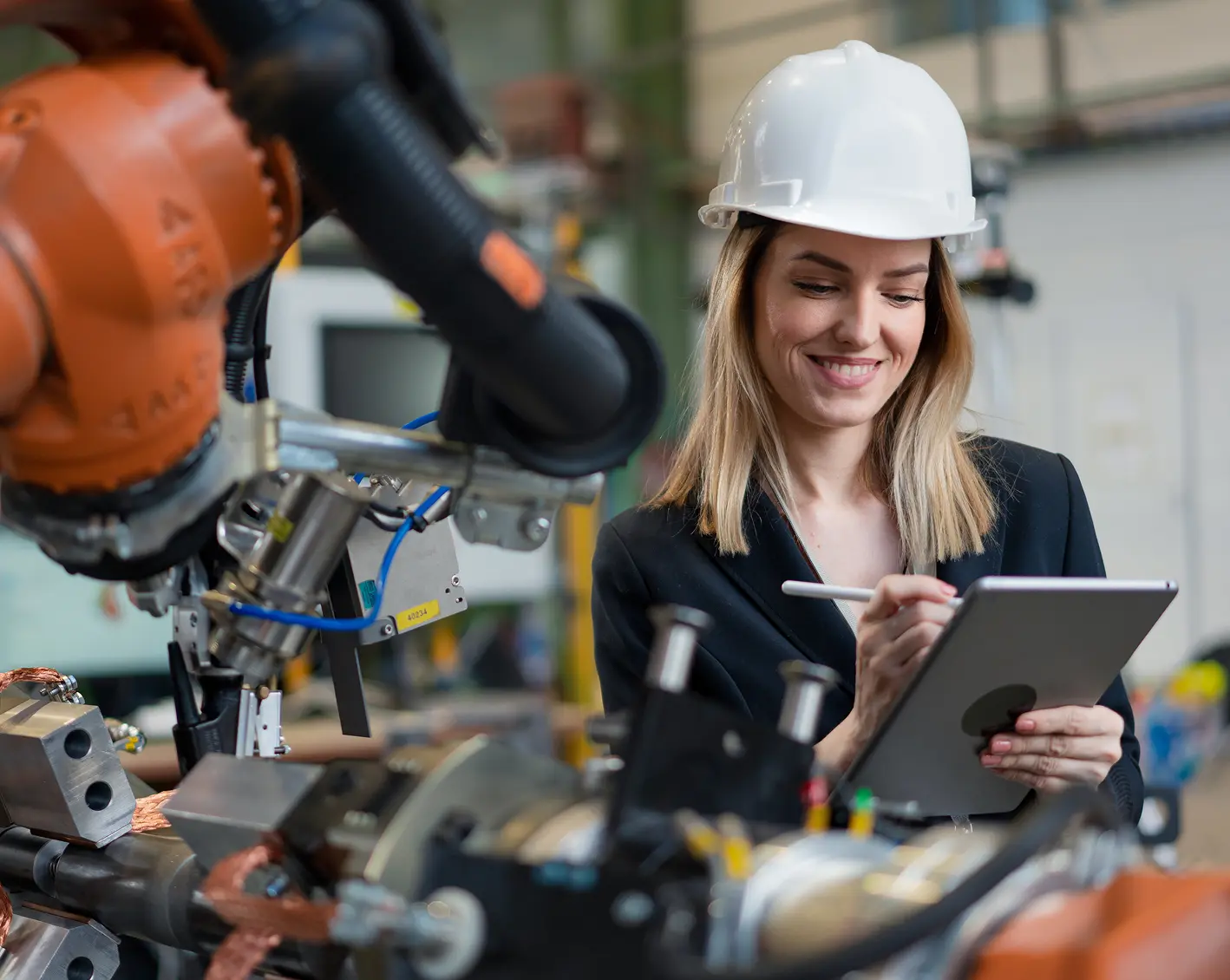 manufacturing employee looking over equipment