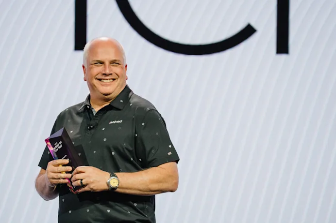 Todd LaFever holding an award