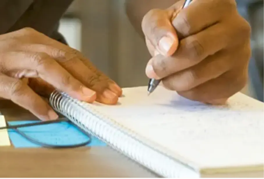 employee making notes about continuation services