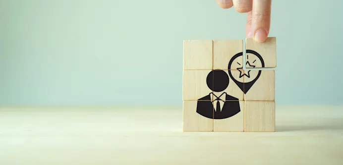 Wooden blocks with a user icon