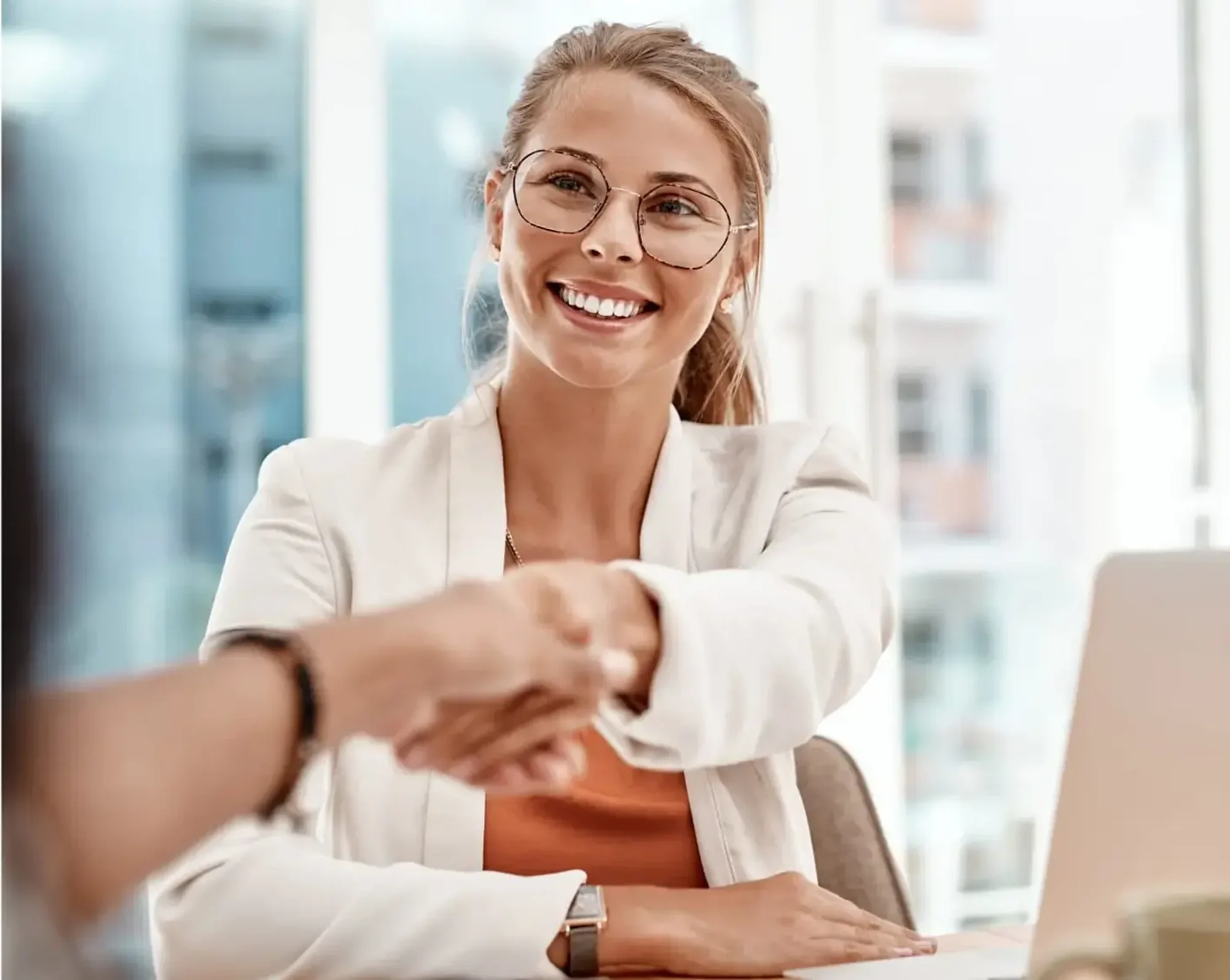 referral shaking hands with sales rep