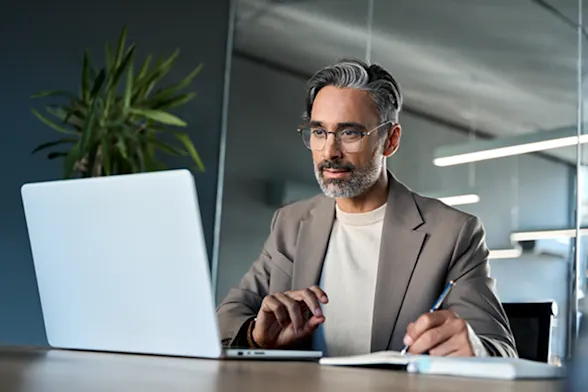 A man working at a laptop
