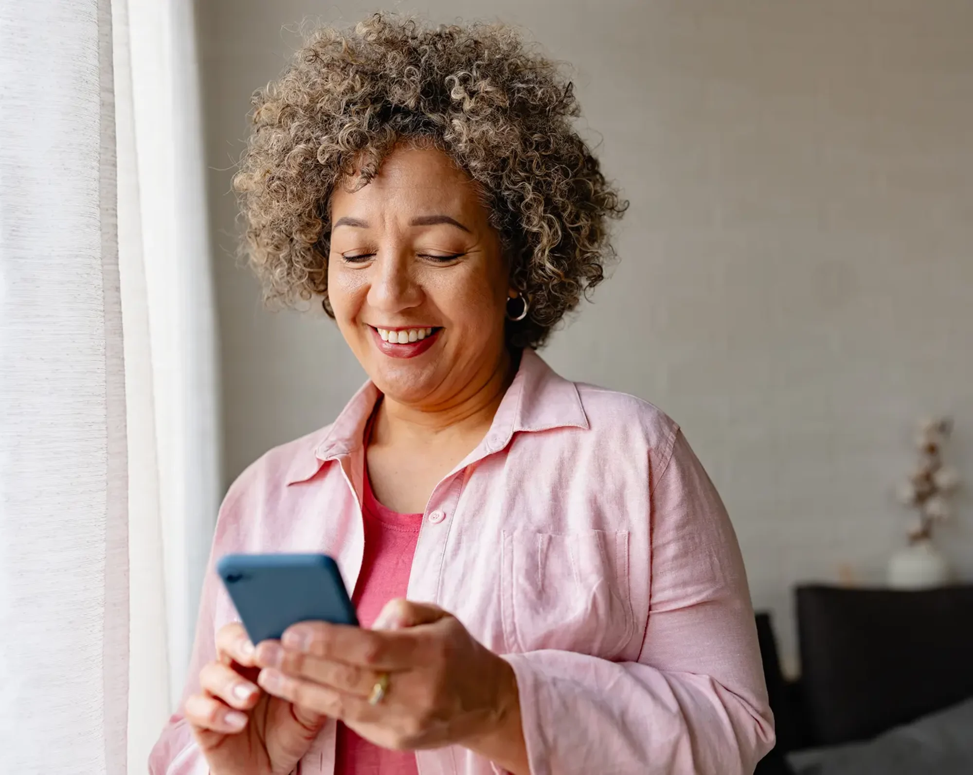woman on phone looking at works marketplace