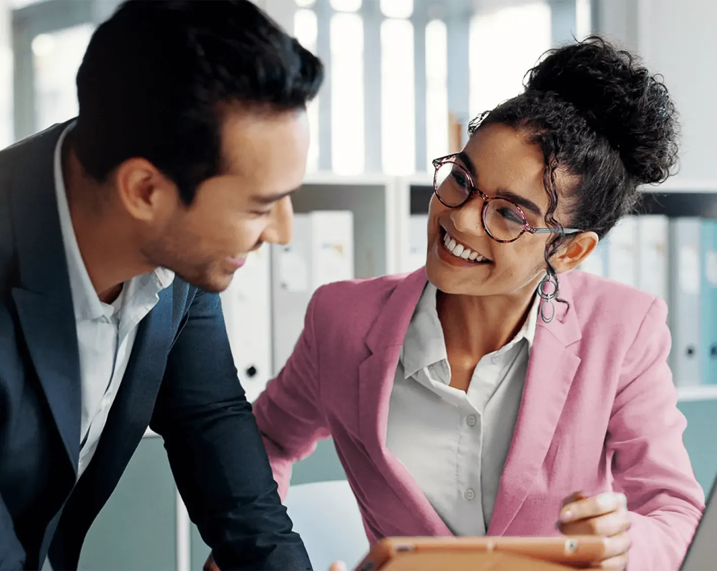 couple of happy employees discussing tax management