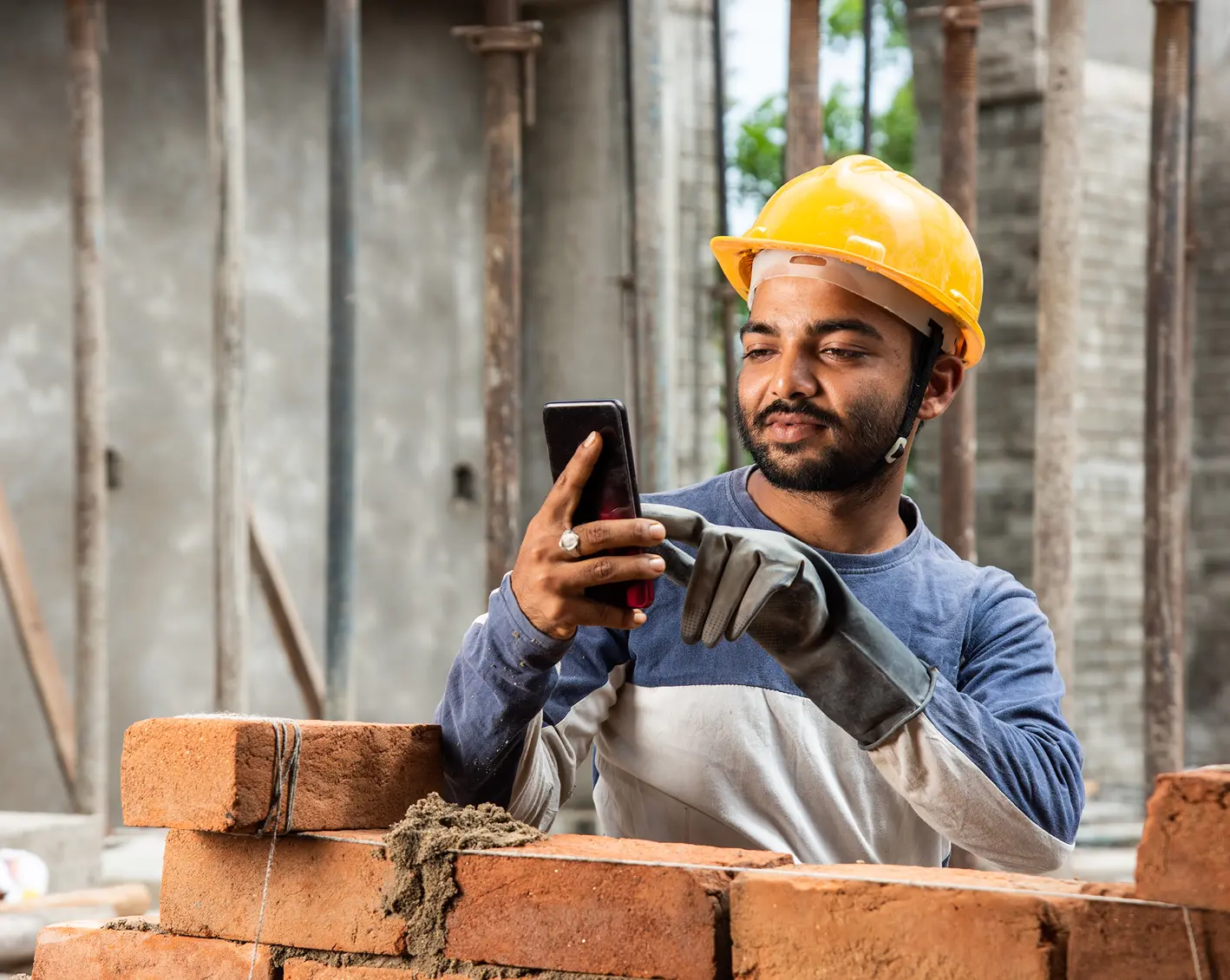 construction worker communicating on phone