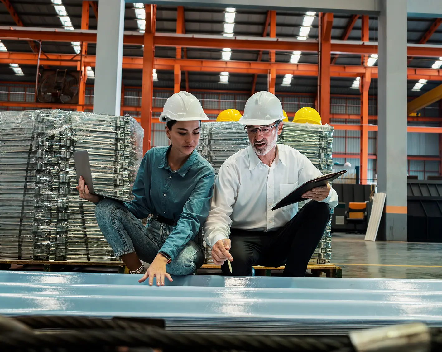 owner looking over manufacturing plant