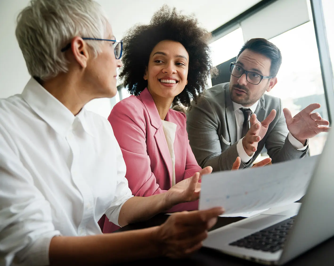3 employees discussing workload