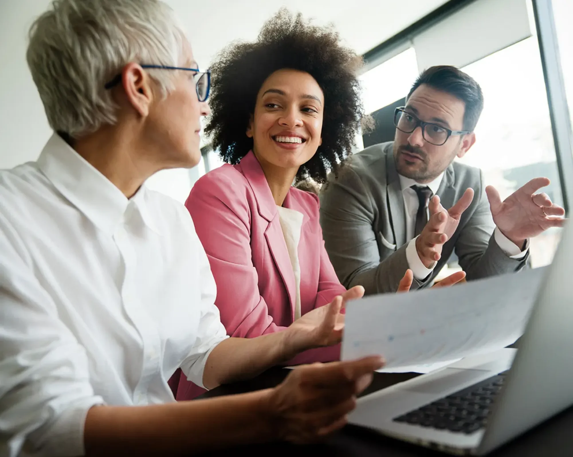 3 employees discussing workload