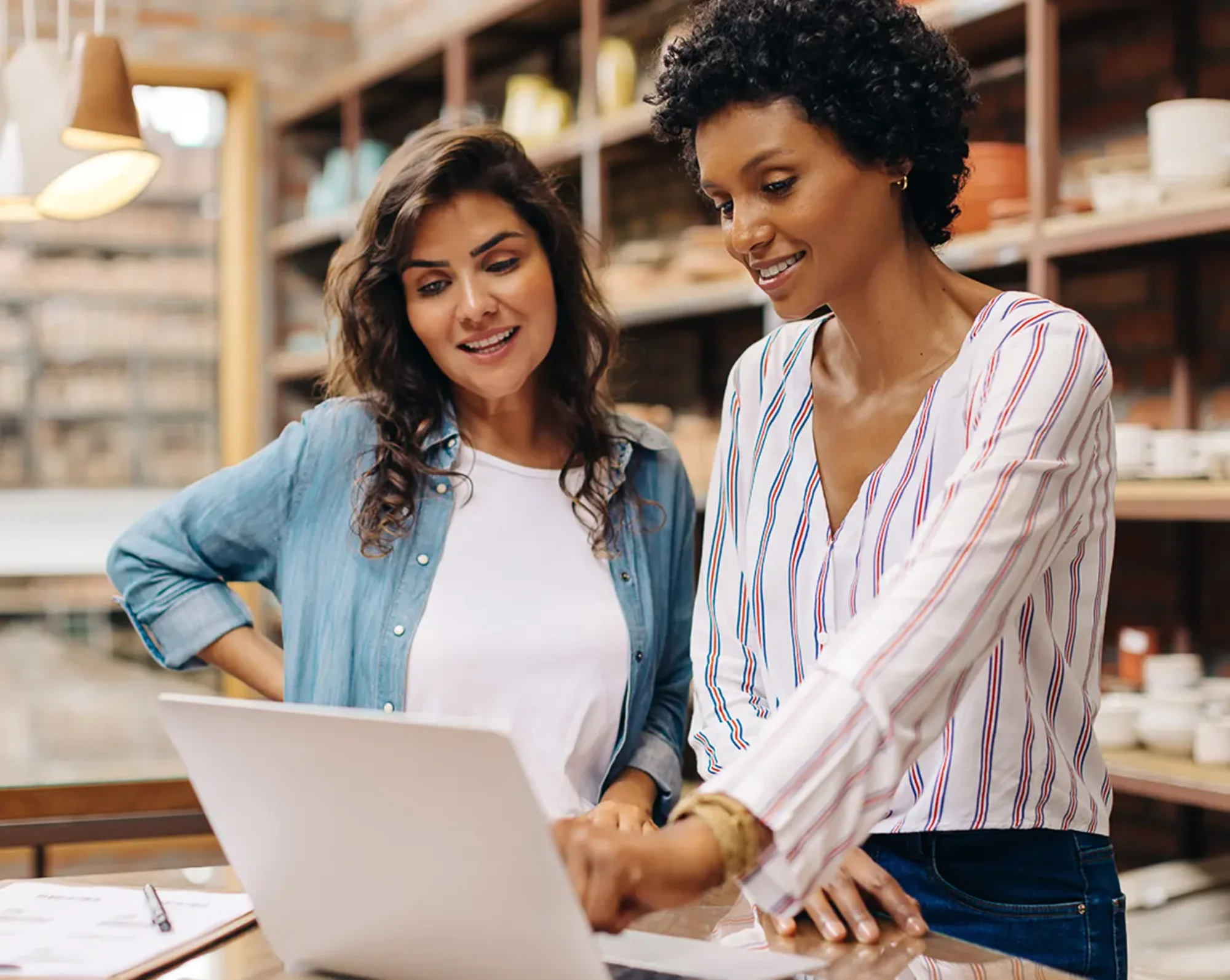 a couple of business women running payroll