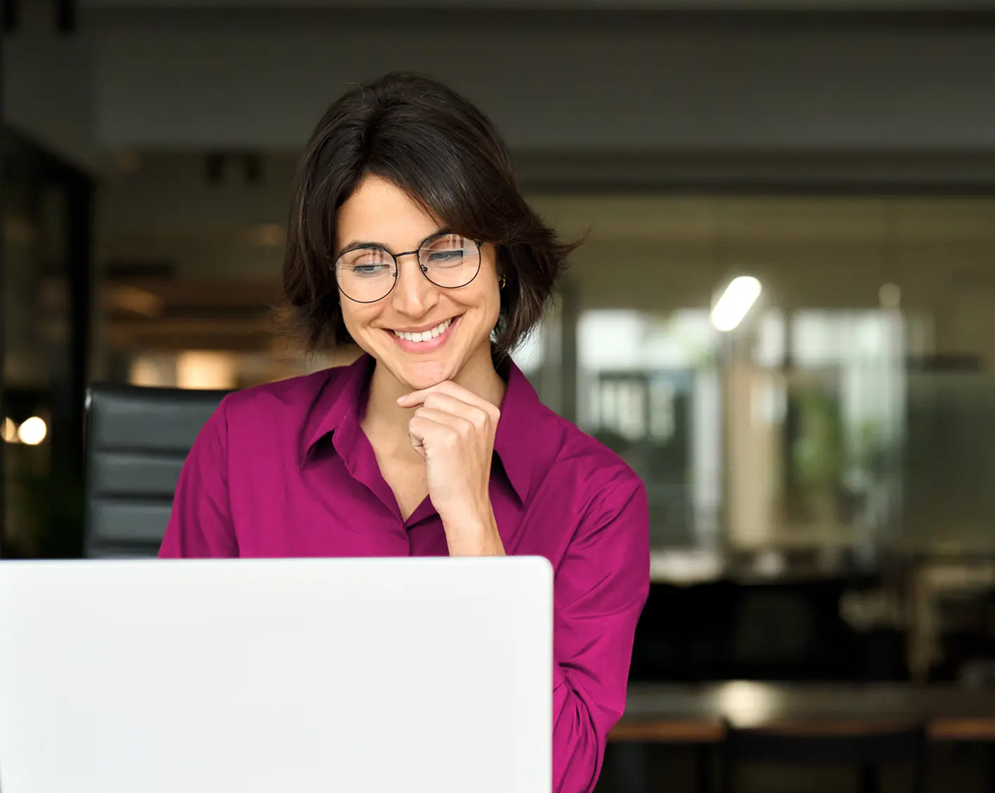 employee looking at computer for premiums eligibility