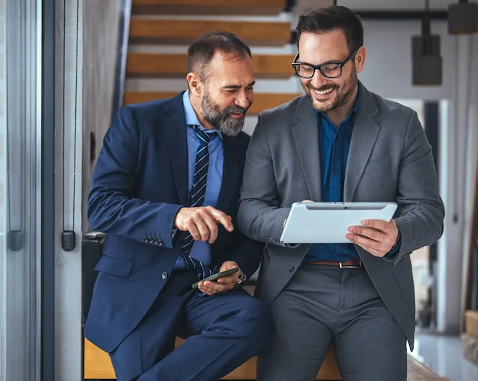 Video play icon. a couple of me looking over a work document