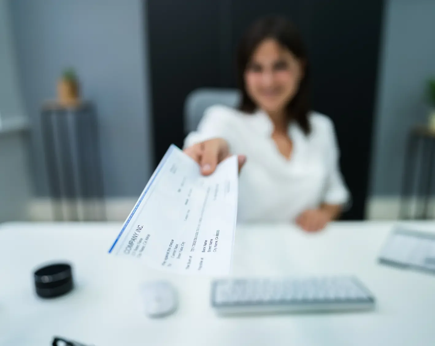 hr handing over a paycheck