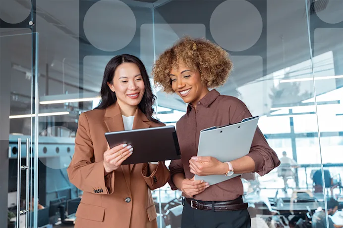 Two women looking at a laptop