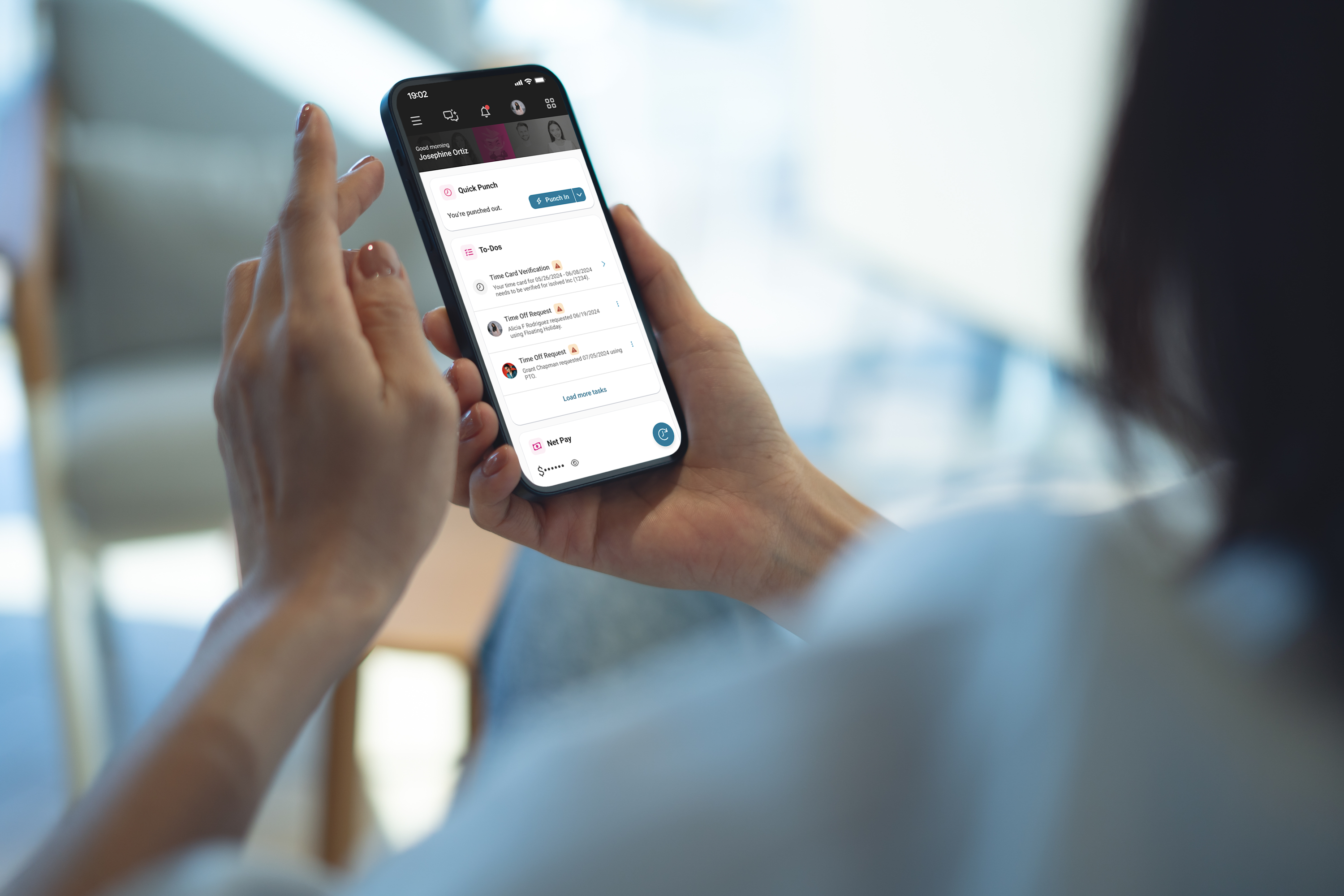 employee managing tasks on computer and phone