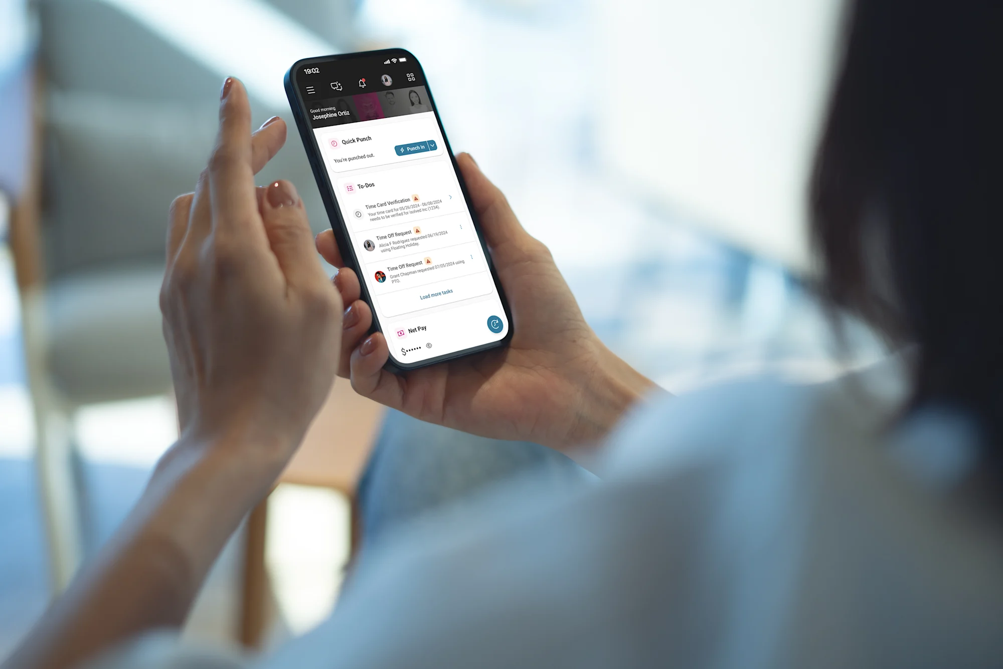 employee managing tasks on computer and phone
