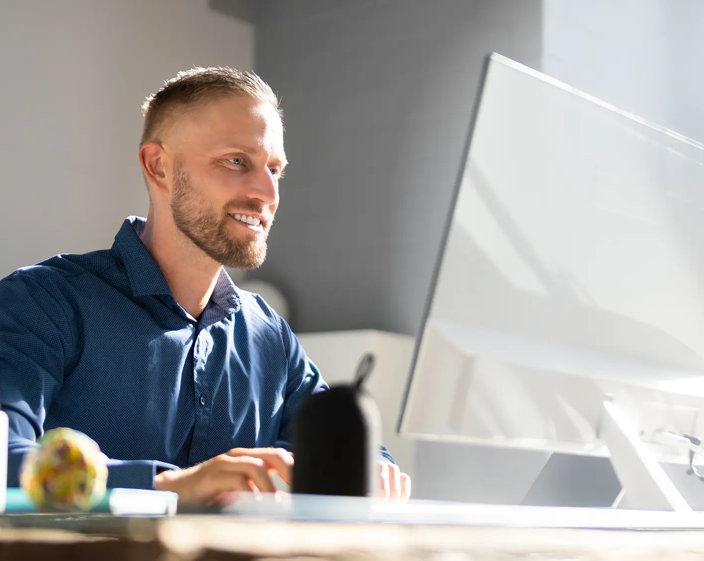 businessman looking at benefits on computer