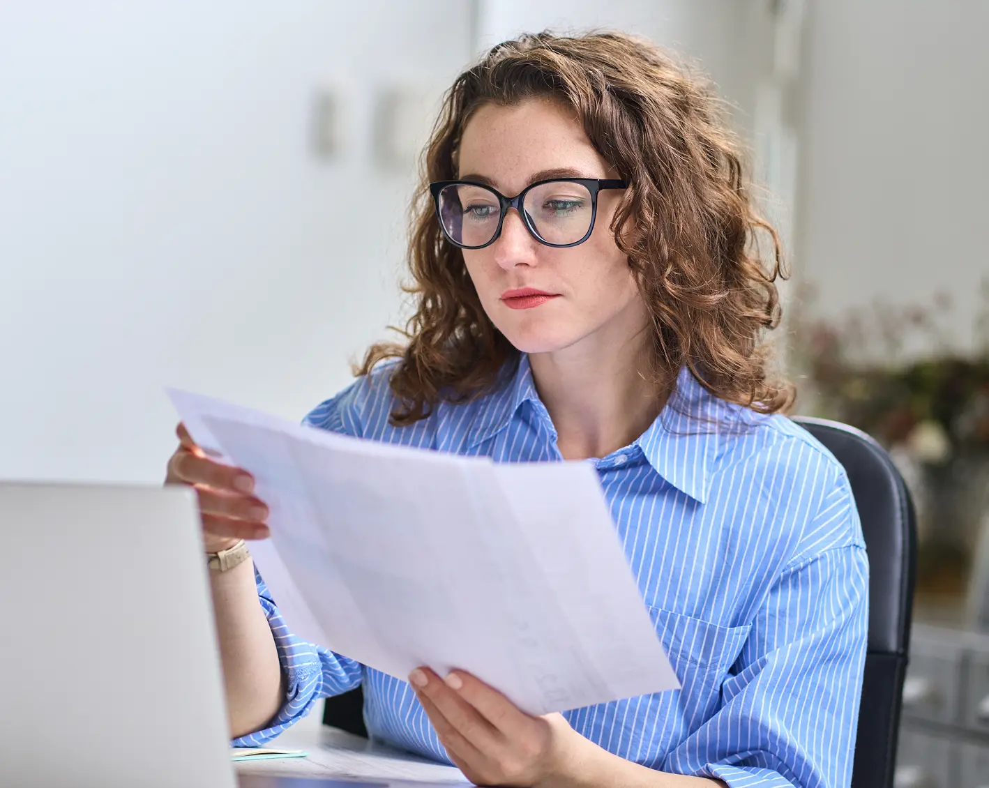 financial advisor looking over notes for client