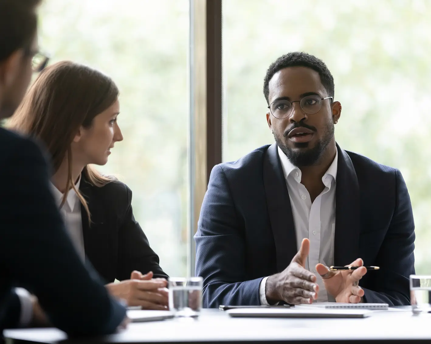 owner of company meeting with employees