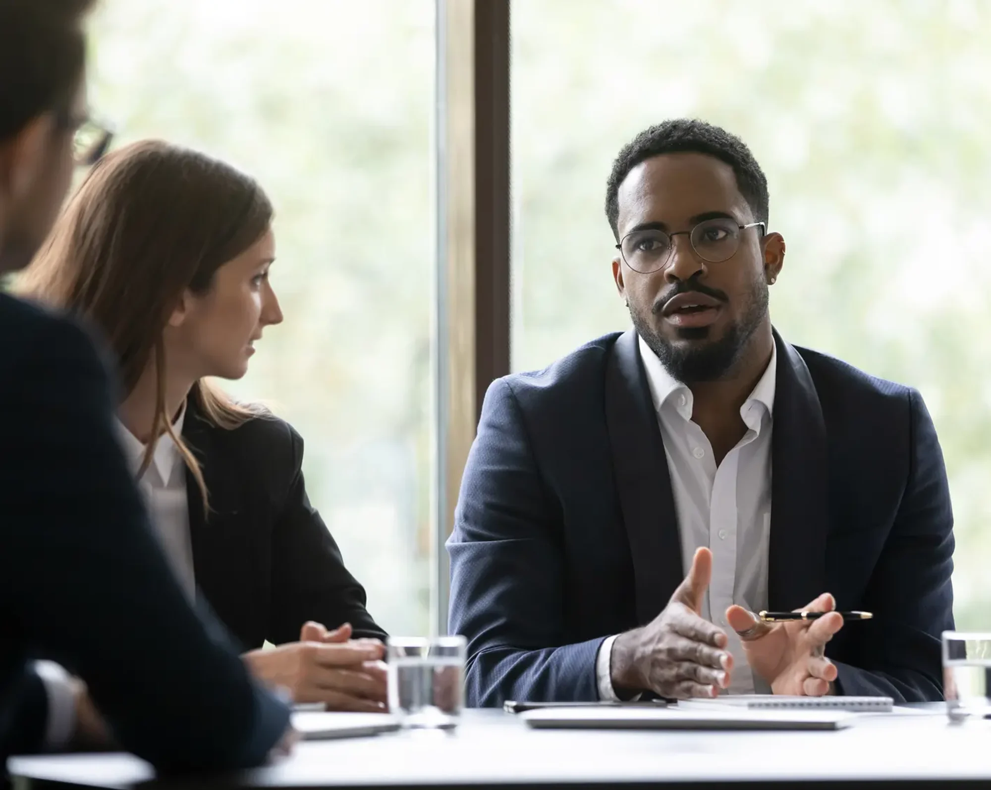 owner of company meeting with employees