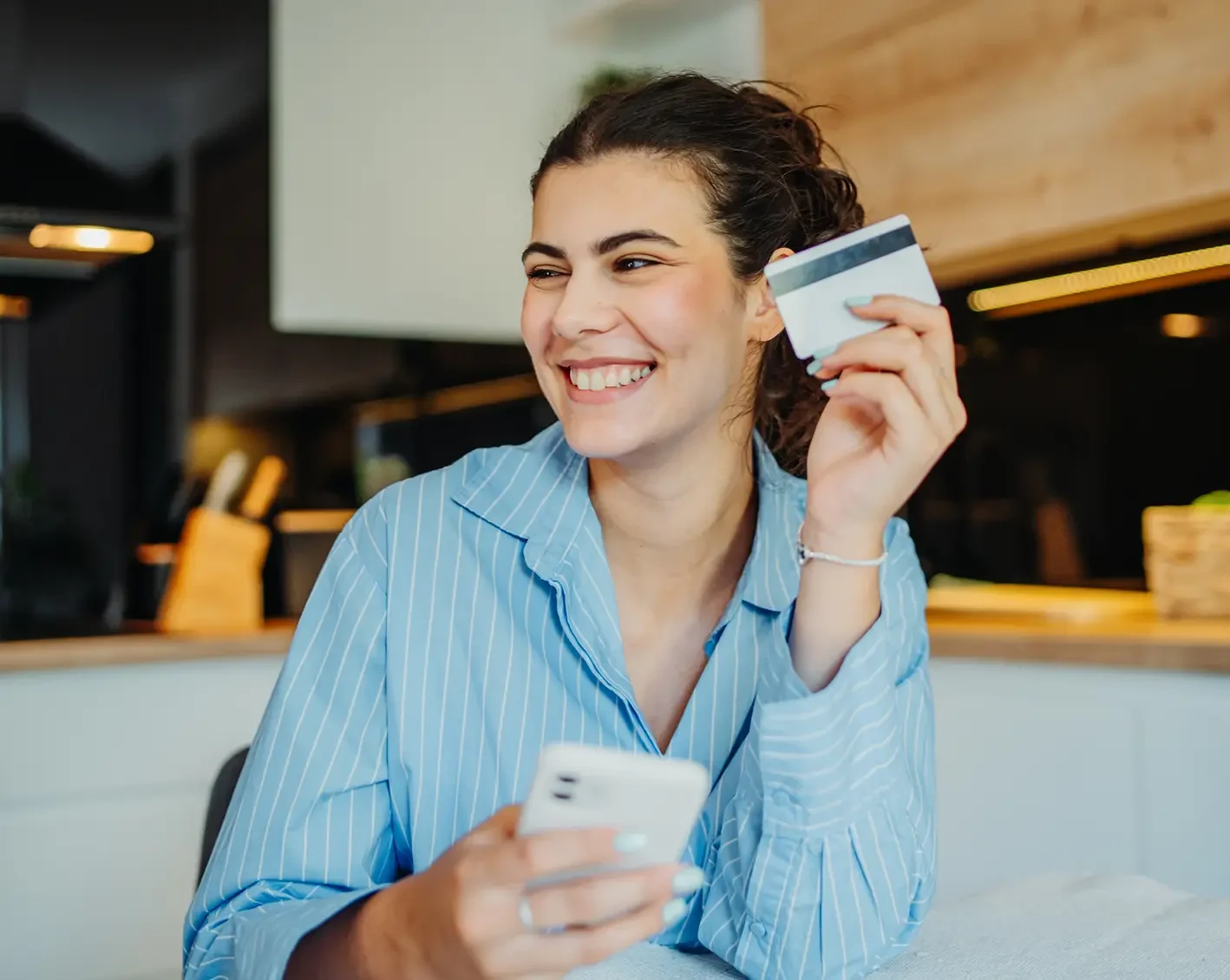 happy woman holding a benefits card