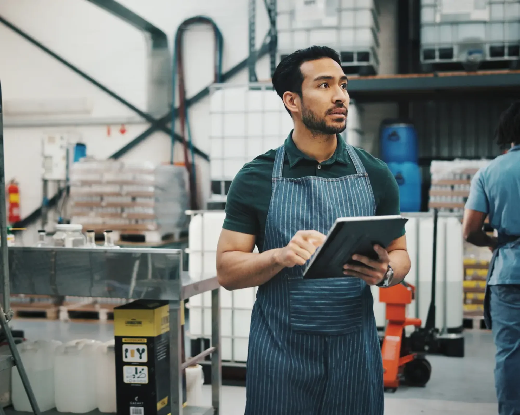 retail employee looking for inventory in warehouse