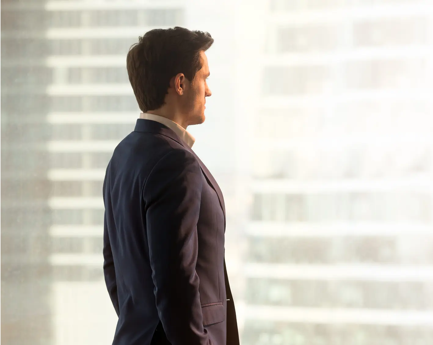 departing employee from company looks out the window