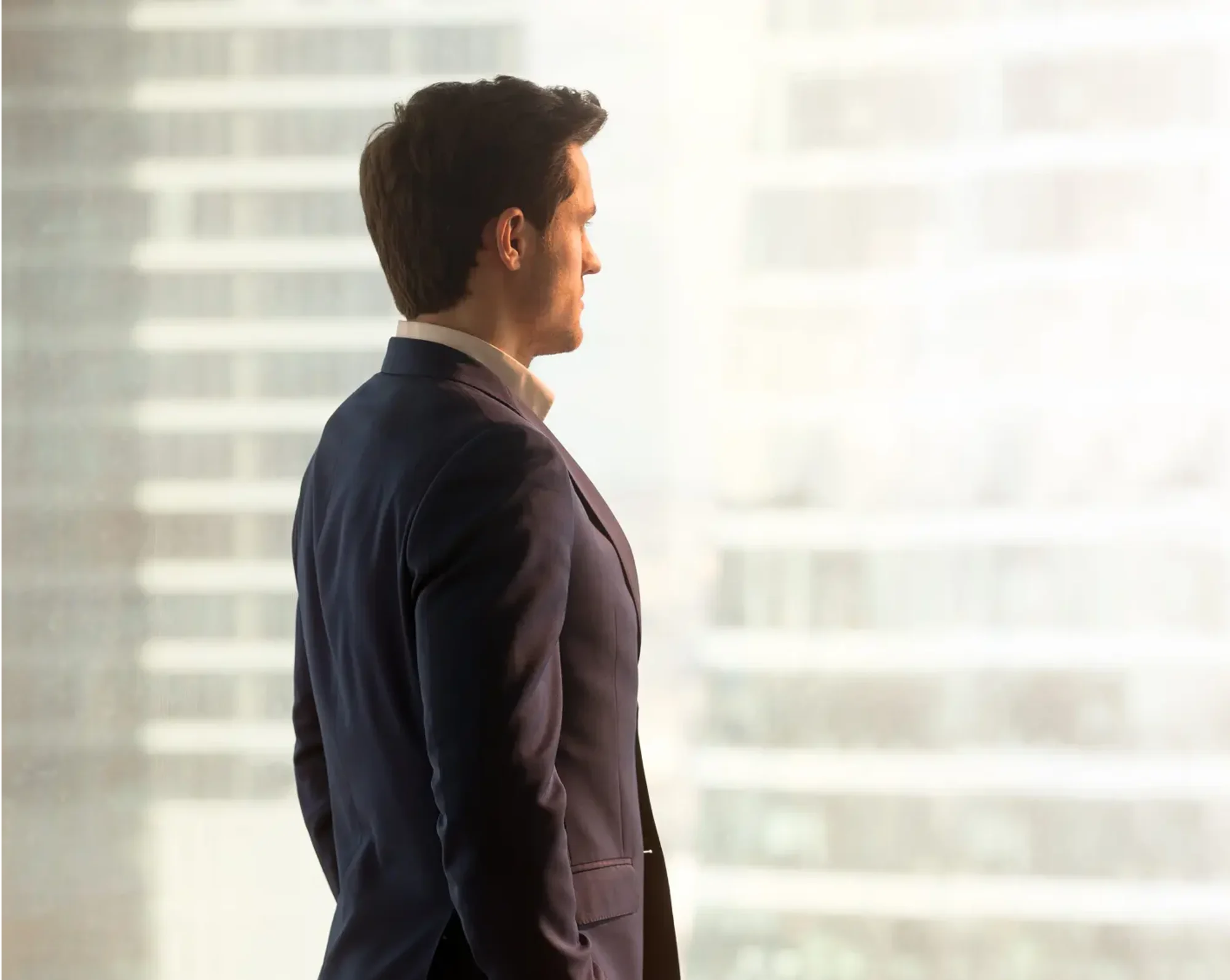 departing employee from company looks out the window