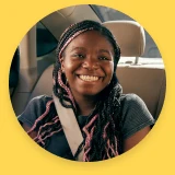 Portrait of a smiling student rider in a car